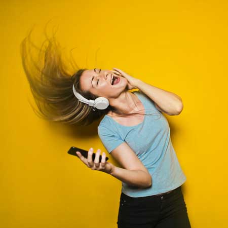 Woman Rocking Out to Music